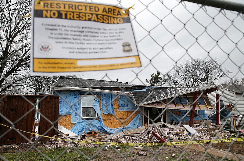 This Feb. 28, 2018, file photo shows the home where Linda "Michellita" Rogers, 12, died in a gas explosion in Dallas, several days earlier. On Tuesday, Jan. 12, 2021, National Transportation Safety Board officials said a natural gas explosion at the home came after an energy company failed to find a damaged line despite two nearby homes being destroyed in gas-related fires on the two previous days. (Vernon Bryant/The Dallas Morning News via AP, File)