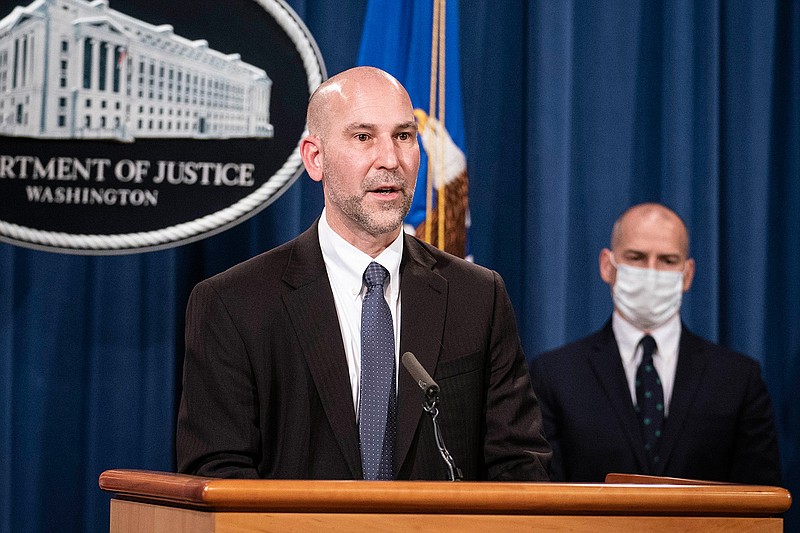 Steven D'Antuono, head of the Federal Bureau of Investigation (FBI) Washington field office, speaks as acting U.S. Attorney Michael Sherwin, right, listens during a news conference Tuesday, Jan. 12, 2021, in Washington. Federal prosecutors are looking at bringing "significant" cases involving possible sedition and conspiracy charges in last week's riot at the U.S. Capitol. (Sarah Silbiger/Pool via AP)