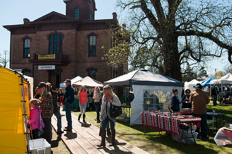 Visitors make their way through a variety of vendors during the 48th annual Jonquil Festival on Saturday, March 19, 2016, in Historic Washington State Park.
