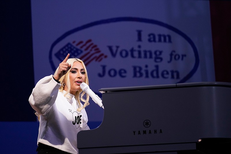In this Nov. 2, 2020 file photo, Lady Gaga performs during a drive-in rally for then Democratic presidential candidate former Vice President Joe Biden at Heinz Field in Pittsburgh.  Lady Gaga will sign the national anthem at Joe Biden's presidential inauguration on the West Front of the U.S. Capitol when Biden is sworn in as the nation's 46th president next Wednesday. (AP Photo/Andrew Harnik)