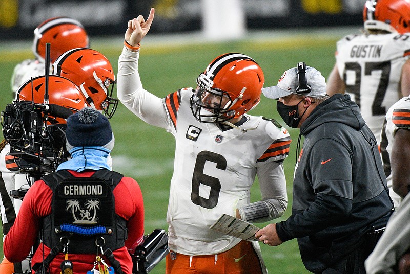 Cleveland Browns offensive coordinator Alex Van Pelt, right, talks with quarterback Baker Mayfield (6) on the sideline during the second half of an NFL wild-card playoff football game against the Pittsburgh Steelers in Pittsburgh, Sunday, Jan. 10, 2021. (AP Photo/Don Wright)