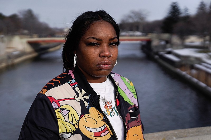 Ariana Hawk is shown at the Flint River in Flint, Mich., Wednesday, Jan. 13, 2021.  "I literally could have cried," said Hawk, sitting in her car after learning former Michigan Gov. Rick Snyder and others in his administration were expected to be charged in a water crisis blamed with causing learning disabilities in scores of children and other medical problems among adults in the majority Black city about 60 miles (95 kilometers) northwest of Detroit.  (AP Photo/Paul Sancya)
