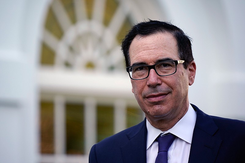 This Aug. 24, 2020 file photo shows Treasury Secretary Stephen Mnuchin at the White House in Washington.  The U.S. government's deficit in the first three months of the budget year was a record-breaking $572.9 billion.  The Treasury Department reported Wednesday, Jan. 13, 2021 that with three months gone in the budget year, the deficit was $216.3 billion higher than the same October-December period a year ago.   (AP Photo/J. Scott Applewhite, File)