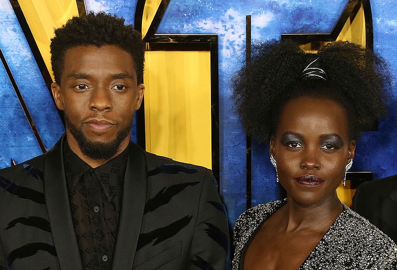 Chadwick Boseman, left, and Lupita Nyong'o arrive at the premiere of their film "Black Panther" on Feb. 8, 2018, in London. Nyong'o has written a long and stirring tribute to Boseman, her late cast mate, calling him a man whose power will "reverberate for generations" in a message posted to her social media accounts 11 days after Boseman's death from colon cancer at age 43. (Photo by Joel C Ryan/Invision/AP, file)