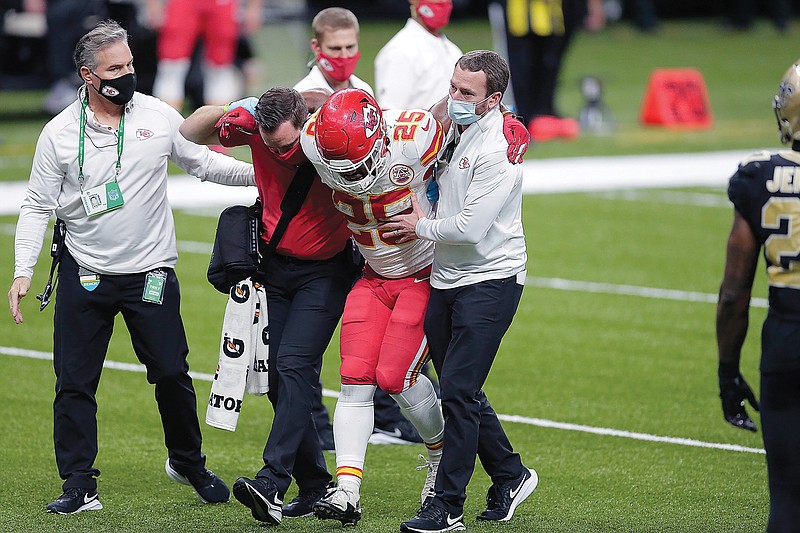 In this Dec. 20, 2020, file photo, Chiefs running back Clyde Edwards-Helaire is helped off the field after being injured in a game against the Saints in New Orleans.