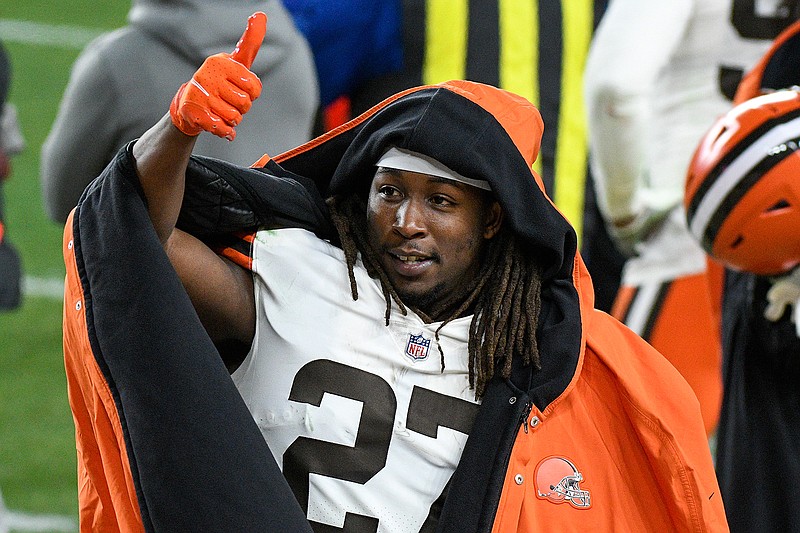 Cleveland Browns running back Kareem Hunt (27) celebrates on the sideline during the first half of an NFL wild-card playoff football game against the Pittsburgh Steelers in Pittsburgh, Sunday, Jan. 10, 2021. (AP Photo/Don Wright)