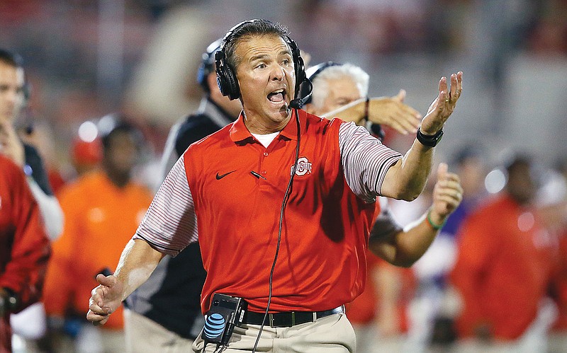 In this Sept. 17, 2016, file photo, Ohio State head coach Urban Meyer shouts from the sideline in a game against Oklahoma in Norman, Okla. 