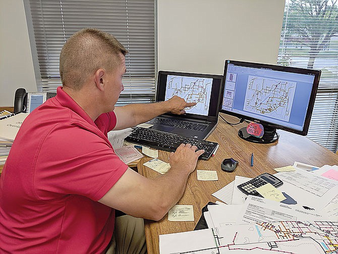 FILE: Interim city engineer Kyle Bruemmer points out problem areas of the sewer system in 2019. In 2021, Visu-Sewer will be working to address other high-inflow areas with repairs and new linings.