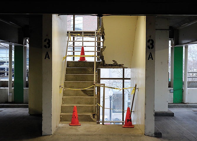 A staircase within the parking garage on Madison Street is closed off with tape and cones Thursday in downtown Jefferson City. The stairwell has been closed for months, in need of repair. The Public Works and Planning Committee discussed a possible plan Thursday morning for fulfilling those repairs. 