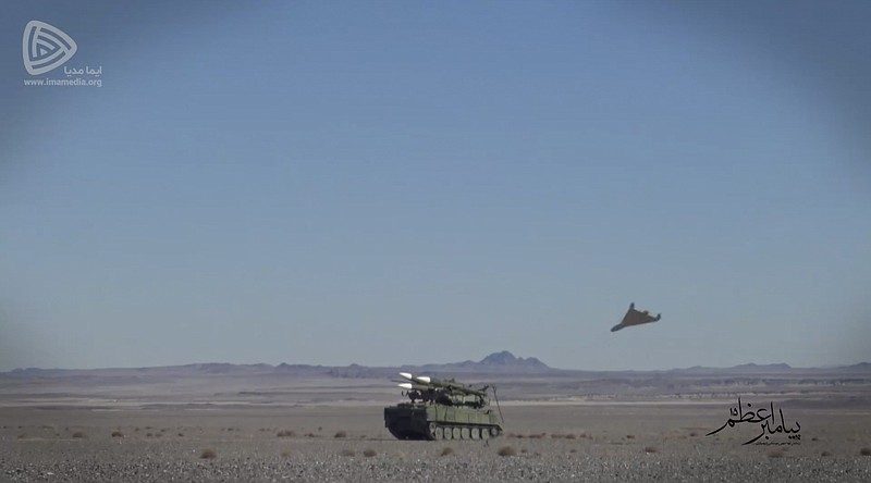 In this photo released Friday, Jan. 15, 2021, by the Imamedia a suicide drone approaches the target during a drill. Iran's paramilitary Revolutionary Guard conducted a drill Friday that saw "suicide drones" crash into targets and explode. (Imamedia via AP)