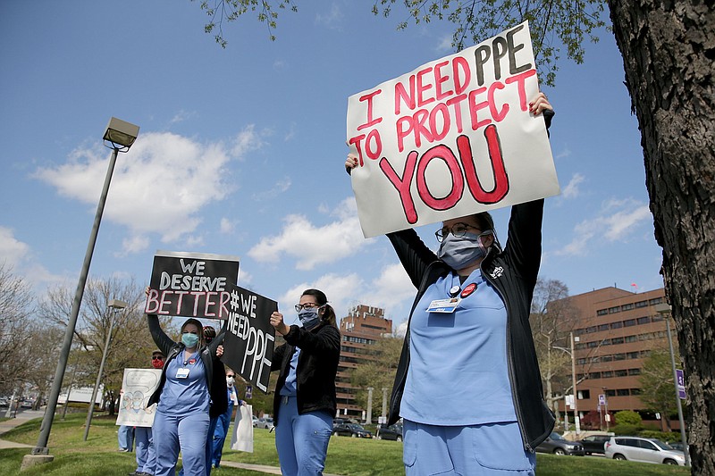 Carly Heller, an ICU nurse at Einstein, right, and her co-workers sought community support outside Einstein Medical Center in April. Now, nurses at Einstein and three other hospitals are fighting for minimum staffing levels. (David Maialetti/The Philadelphia Inquirer/TNS)