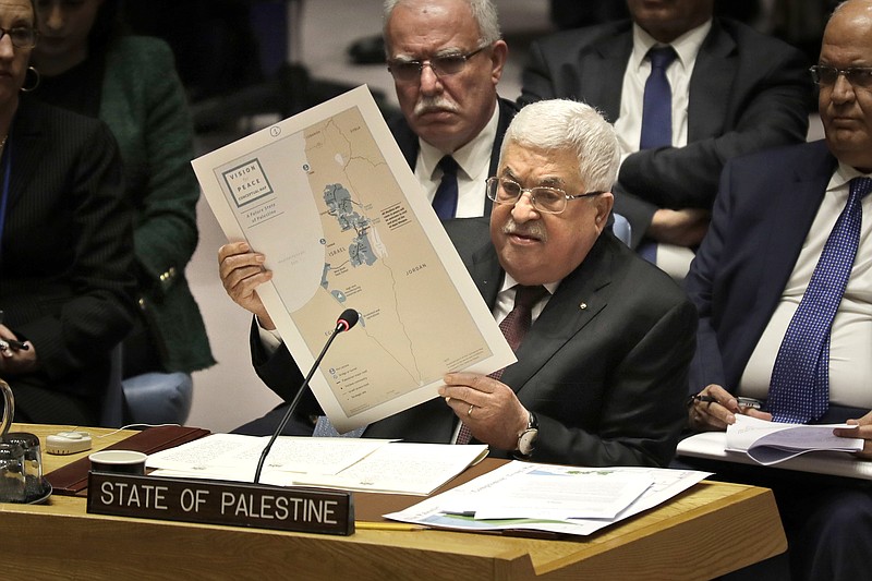 FILE - In this Feb. 11, 2020 file photo, Palestinian President Mahmoud Abbas speaks during a Security Council meeting at United Nations headquarters.  Abbas has announced that the first presidential and parliamentary elections since 2006 will be held later in 2021. The voting is seen as a key step in mending a rift between Abbas’ Fatah party that rules the West Bank and the Islamic militant group Hamas that controls the Gaza Strip. ( (AP Photo/Seth Wenig, File)