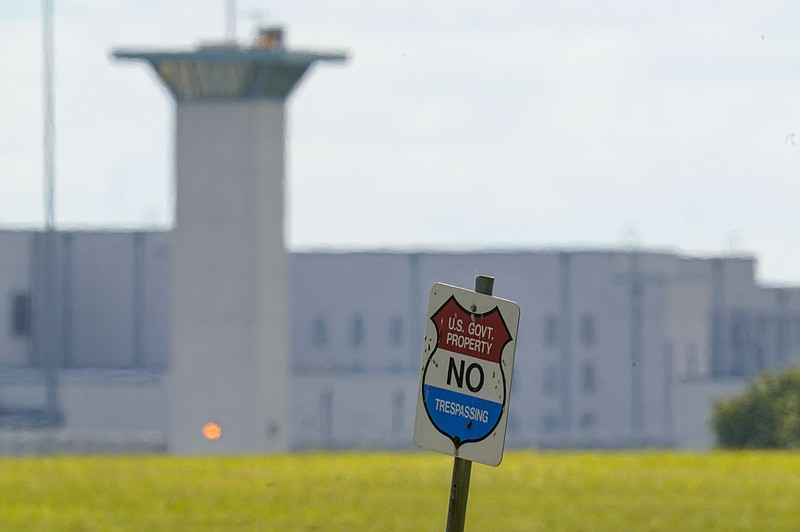 FILE - In this Aug. 26, 2020, file photo, the federal prison complex in Terre Haute, Ind. All federal prisons in the United States have been placed on lockdown, with officials aiming to quell any potential violence that could arise behind bars as law enforcement prepares for potentially violent protests across the country in the run-up to President-elect Joe Biden's inauguration on Wednesday. (AP Photo/Michael Conroy, File)