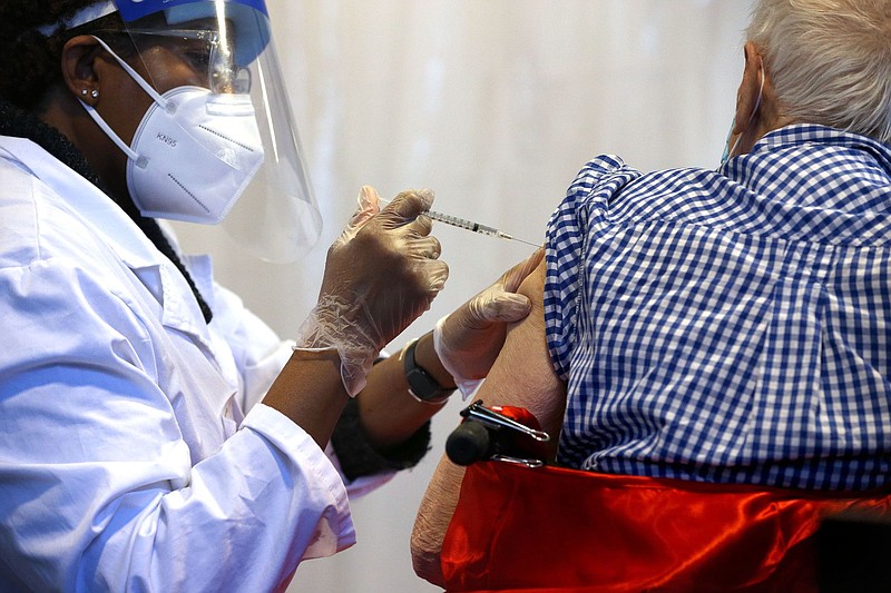 Dino Franceschina receives a COVID-19 vaccine at Caledonia Senior Living and Memory Care in North Riverside, Illinois, on Jan. 12, 2021.  (Antonio Perez / Chicago Tribune/TNS)