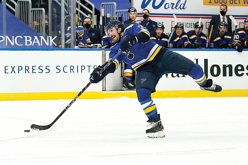 Justin Faulk of the Blues shoots during the second period of Monday night's game against the Sharks in St. Louis.