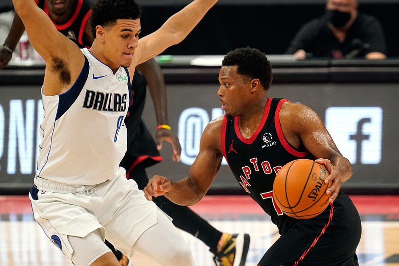 Toronto Raptors guard Kyle Lowry (7) drives against Dallas Mavericks guard Josh Green (8) during the second half of an NBA basketball game Monday, Jan. 18, 2021, in Tampa, Fla. (AP Photo/Chris O'Meara)