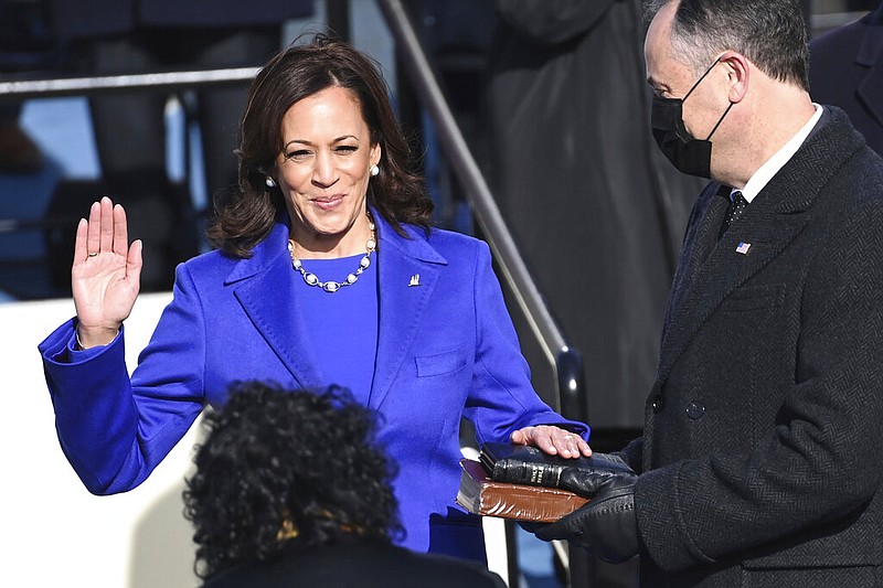 Kamala Harris is sworn in as vice president by Supreme Court Justice Sonia Sotomayor as her husband Doug Emhoff holds the Bible during the 59th Presidential Inauguration at the U.S. Capitol in Washington, Wednesday, Jan. 20, 2021.(Saul Loeb/Pool Photo via AP)