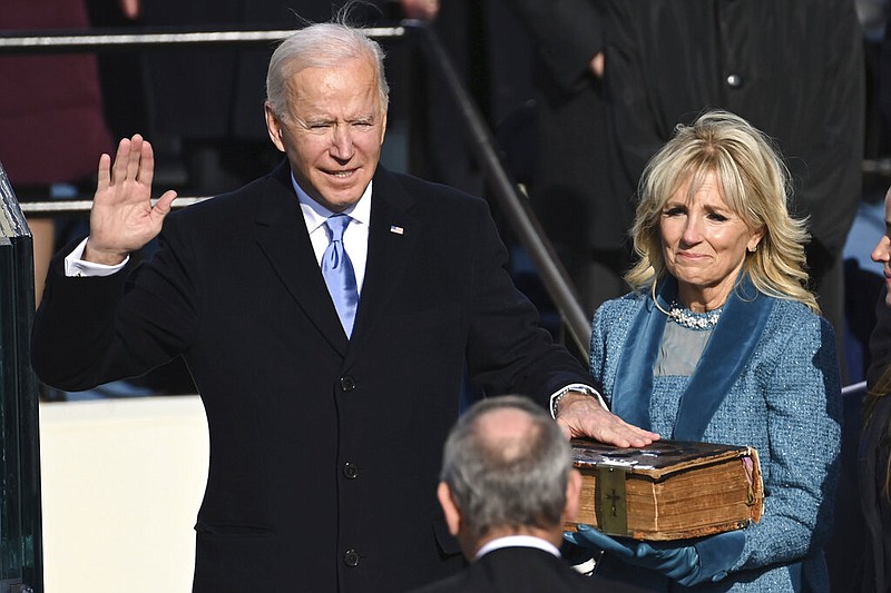 Joe Biden is sworn in as the 46th president of the United States by Chief Justice John Roberts as Jill Biden holds the Bible during the 59th Presidential Inauguration at the U.S. Capitol in Washington, Wednesday, Jan. 20, 2021