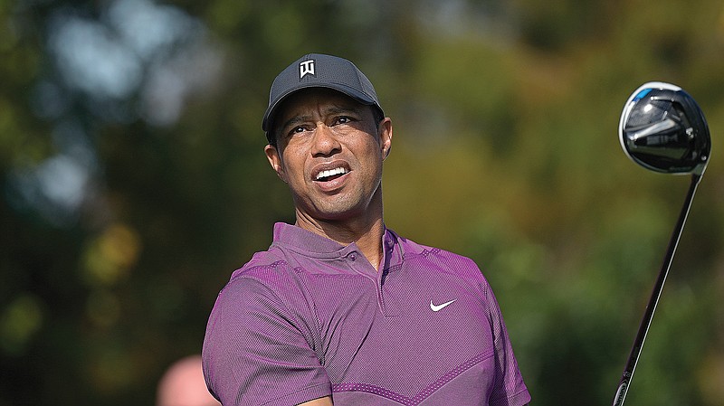 Tiger Woods watching his tee shot on the first hole during the first round of the PNC Championship last month in Orlando, Fla.