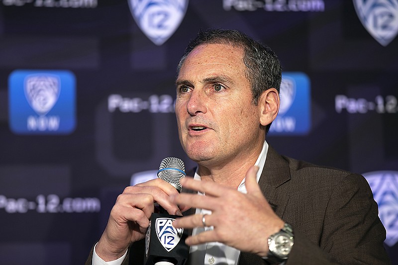 In this Oct. 7, 2019, file photo, Pac-12 commissioner Larry Scott speaks to reporters during the Pac-12 Conference women's basketball media day in San Francisco.