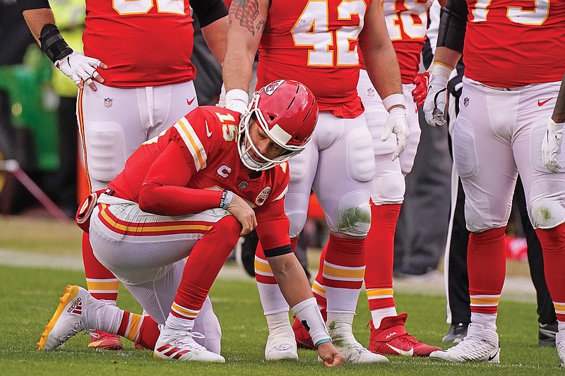 Chiefs quarterback Patrick Mahomes kneels on the field after getting injured during the second half of Sunday's divisional playoff game against the Browns at Arrowhead Stadium in Kansas City. 