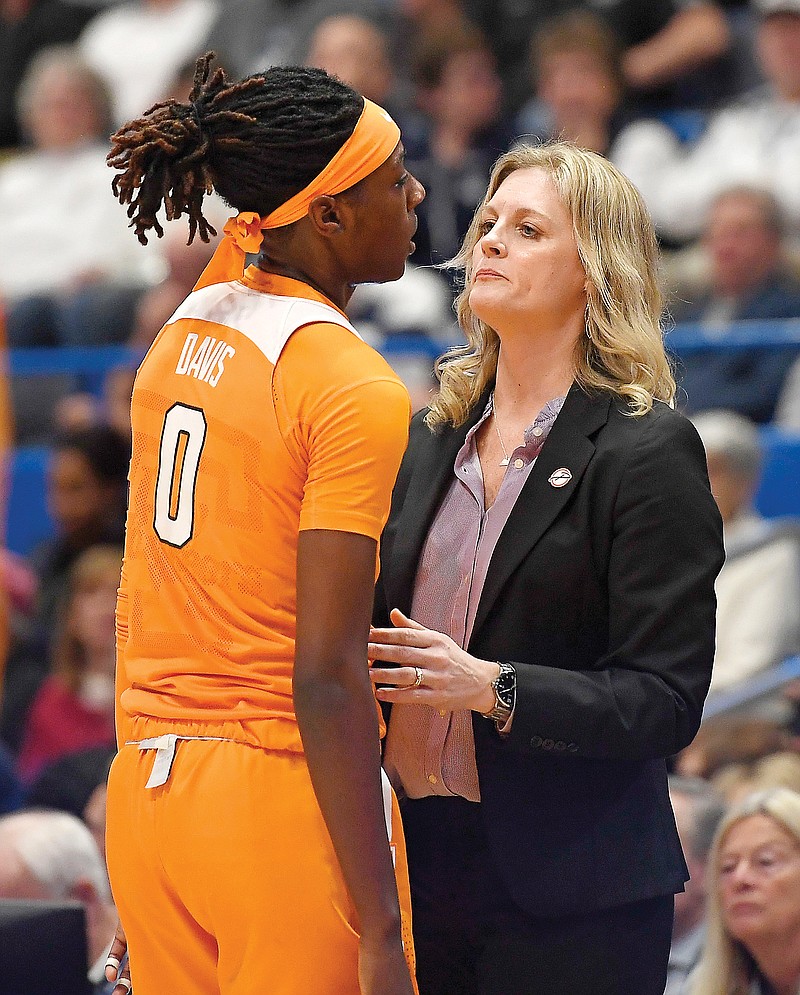 In this Jan. 23, 2020, file photo, Tennessee coach Kellie Harper (right) talks with Rennia Davis during a game in Hartford, Conn. 