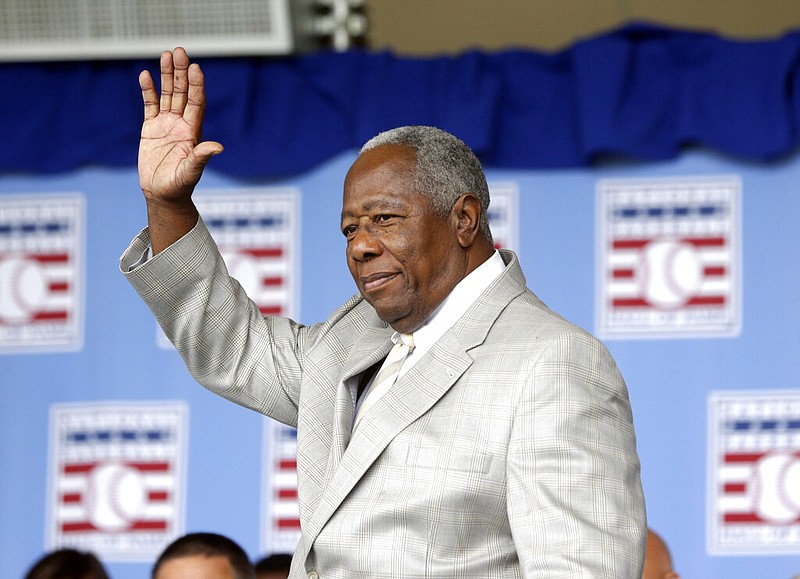 Hall of Famer Hank Aaron waves to the crowd during Baseball Hall of Fame induction ceremonies in Cooperstown, N.Y., in this Sunday, July 28, 2013, photo.