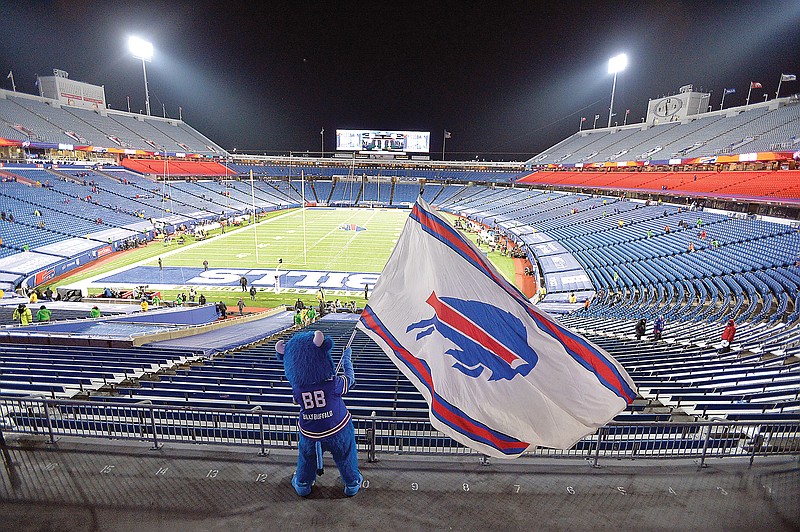 Bills fans leave Bills Stadium as the mascot waves a team flag after last Saturday night's win against the Ravens in Orchard Park, N.Y.