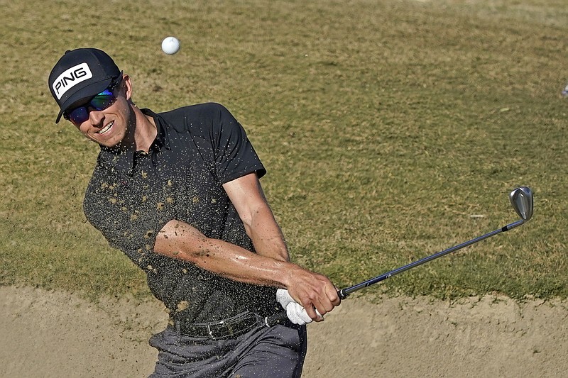 Brandon Hagy hits from the bunker to the 17th green during Thursday's first round of The American Express Tournament on the Nicklaus Tournament Course at PGA West in La Quinta, Calif.