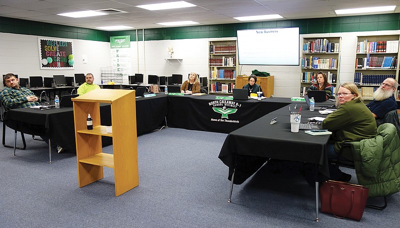 Members of the North Callaway Board of Education turn to listen to a speaker during Thursday night's meeting. Board member Greg Huddleston was absent.