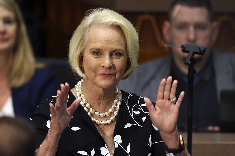 FILE - In this Jan. 13, 2020, file photo Cindy McCain, wife of former Arizona Sen. John McCain, waves to the crowd after being acknowledged by Arizona Republican Gov. Doug Ducey during his State of the State address on the opening day of the legislative session at the Capitol in Phoenix. Arizona Republicans voted Saturday, Jan. 23, 2021 to censure Cindy McCain and two prominent GOP officials who have found themselves crosswise with former President Donald Trump. (AP Photo/Ross D. Franklin, File)