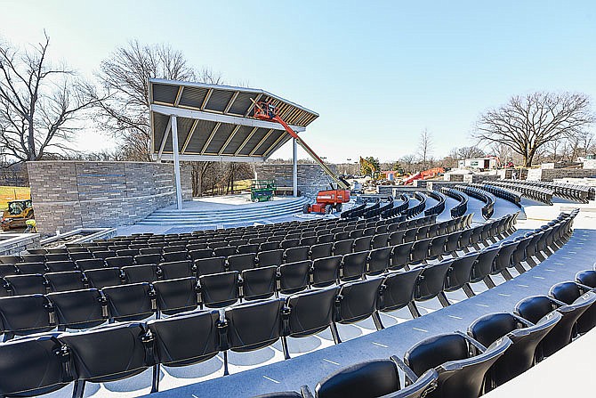 Winter didn't slow down progress at Riverside Park amphitheater. Employees of Verslues Construction worked Friday, Jan. 23, 2021, to pour concrete and install lumber under the inside of the canopy.
