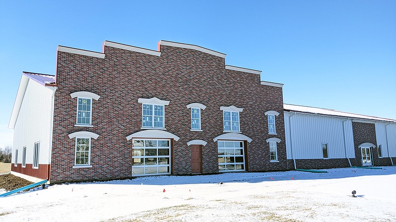 <p>Helen Wilbers/For the News Tribune</p><p>Though the fire station-themed exterior of the Missouir Firefighters Museum is largely complete, the interior is empty. Kenneth Hoover, a member of the Firefighter Memorial Board, said it will take another $250,000-$300,000 to complete the museum.</p>