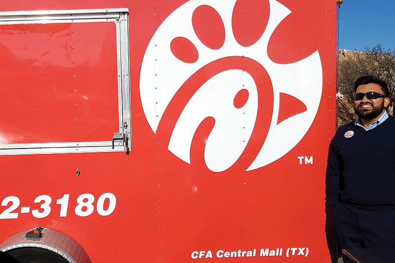 Sanel Thomas, owner of Chick-fil-A, Central Mall, stands beside the new mobile Chick-fil-A trailer, which is almost ready for its first run. Thomas aims to bring Chick-fil-A food to places that otherwise might have a fairly long commute to the restaurant, he said.