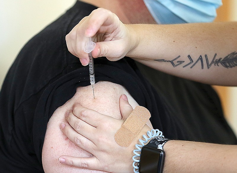 A resident receives a COVID-19 vaccination Thursday, Jan. 28, 2021, from the Cole County Health Department. 