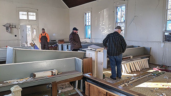 Vandals did extensive damage to Oakley Chapel, a historically Black church, last weekend. Several locals visited the church Thursday to survey the damage and board up the church's windows before weather could do further harm.