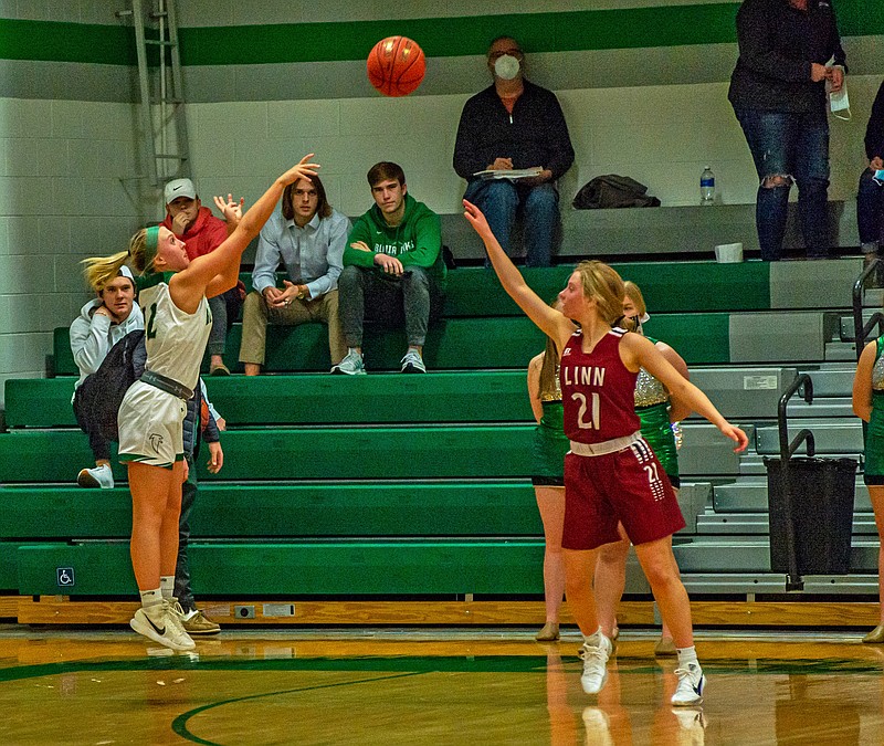 Bailey Rissmiller of Blair Oaks shoots a 3-pointer from the corner as Linn's Lindsey Brandt defends during Monday night's game in Wardsville.