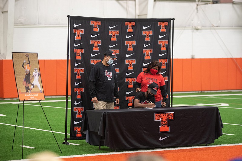 Texas High School football player Caleb Arnold signed to play football with Liberty University next fall. Texas High celebrated their students that will move forward with sports in college Wednesday morning at the Multipurpose Facility on campus.