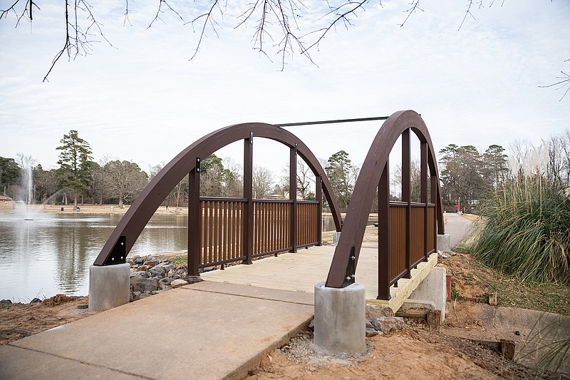 A grant from the Texas Parks and Wildlife Department funded the construction of two arched bridges along the walking trail at the south end of Spring Lake Park's pond.