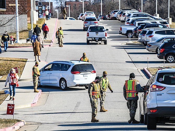 Members of the Missouri Army National Guard assisted state and local health agencies Feb. 5 at The Linc by directing traffic. There was a steady line of vehicles in the area for hours as people who pre-registered for the vaccine went to get their shot.