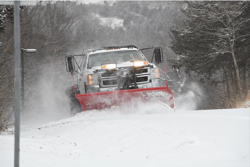 Keith Gardner of Bias Lawn Care clears snow from Bennett Lane near Jefferson City on Wednesday, Feb. 10, 2021.