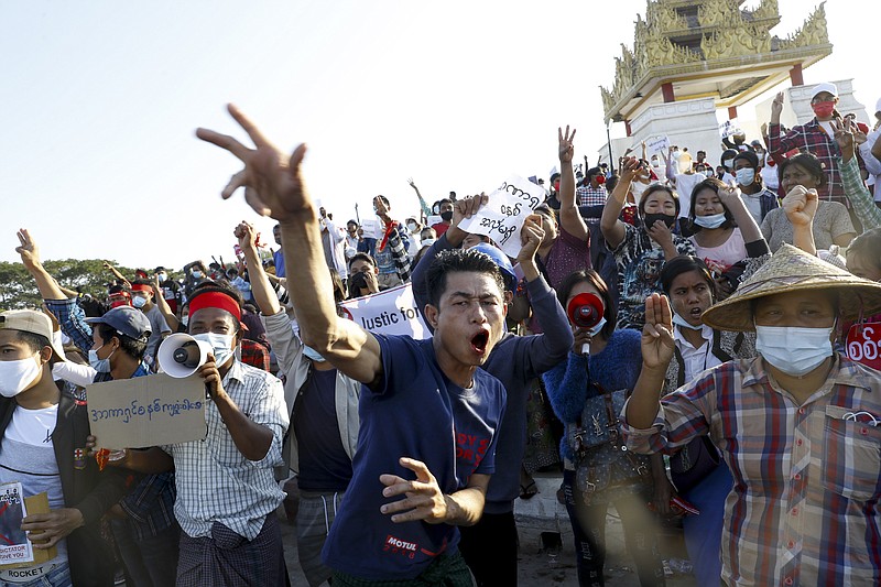 FILE - In this Feb. 10, 2021, file photo, demonstrators flash a three-fingered symbol of resistance against the military coup and shout slogans calling for the release of detained Myanmar leader Aung San Suu Kyi during a protest in Mandalay, Myanmar. When army generals in Myanmar staged a coup last week, they briefly cut internet access in an apparent attempt to stymie protests. Around the world, shutting down the internet has become an increasingly popular tactic by repressive and authoritarian regimes and some illiberal democracies. (AP Photo, File)