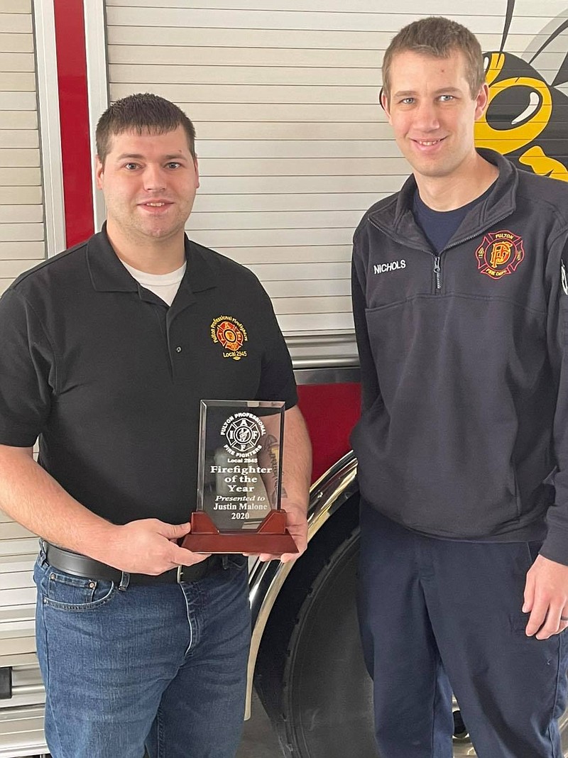 <p>Engineer Justin Malone, left, was named Fulton Professional Firefighters Local 2945’s Firefighter of the Year for 2020. Malone started with the Fulton Fire Department in 2015 and became an engineer in 2017. In 2018, he was named vice president of Local 2945. In that role, he spearheaded a mental health initiative for his fellow firefighters. He’s now president of L2945 and continues his work on the mental health initiative. The Firefighter of the Year Award recipient is selected based on a nomination and evaluation process involving current members of the Fulton Professional Firefighters union. Malone is pictured with L2945 secretary/treasurer Logan Nichols.</p>