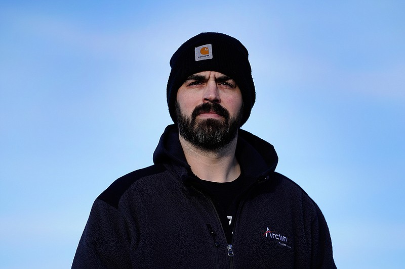 Stuart Hill, a United Auto Workers member who works at the General Motors Toledo Transmission Operations facility, poses in Toledo, Ohio, Tuesday, Feb. 2, 2021.   At 38 years old and a GM employee for five years, Hill is still decades from retirement. He wonders about the future of that plant and his role in it.  "It's something that's in the back of my mind," Hill said. "Are they going to shut it down?" (AP Photo/Paul Sancya)