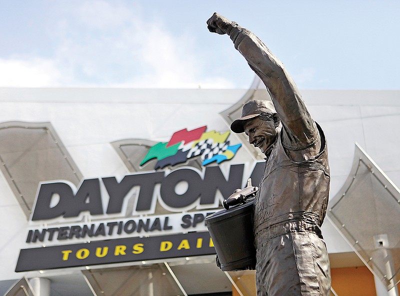 In this Feb. 16, 2011, file photo, a statue of Dale Earnhardt rises above an entrance at Daytona International Speedway in Daytona Beach, Fla.