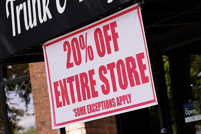 This Oct. 1, 2020 photo shows a sale sign is posted outside a store in Nashville, Tenn.  There are now multiple layers of tax benefits for small business owners who took advantage of the Paycheck Protection Program. Business owners can claim otherwise deductible expenses, even if they were paid using PPP loan funds.  (AP Photo/Mark Humphrey)