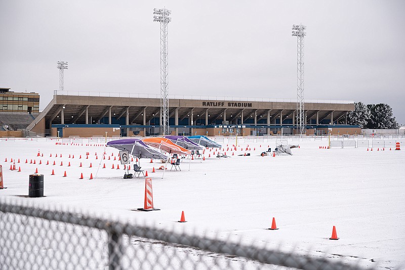 The mass vaccination clinic put on by Medical Center Hospital and the City of Odessa at Ratliff Stadium is seen covered in snow and ice Saturday in Midland, Texas. Subfreezing temperatures are expected in all of Texas, according to the National Weather Service, and snowfall totals of up to 8 inches are forecast in the Dallas area. Up to 2 inches could fall in the Houston area.