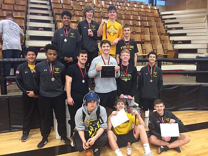 Members of the Boys' Fulton Hornets wrestling club smile Jan. 30 after a successful day at the Buffalo Thundering Herd Tournament. Starting next season, the Fulton Wrestling Club will no longer operate under as a Fulton Parks and Recreation Department program.