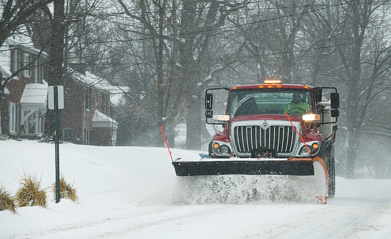 Snow plow drivers running constant routes did their best to keep a driving lane open as snow continued to fall over Mid-Missouri on Monday, Feb. 15, 2021.