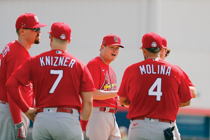 In this Feb. 12, 2020, file photo, Cardinals manager Mike Shildt talks with members of his team during a spring training practice in Jupiter, Fla.